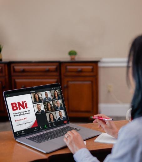 Professional participating in a BNI online networking meeting.